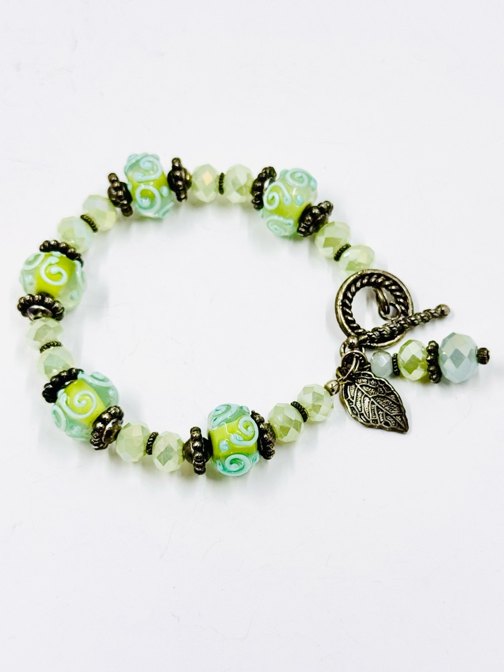 Mint Green Glass Wedding Cake Beads Bracelet W/Toggle Closure & Leaf Charm. 6.5”